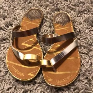Bronze, silver, and gold sandals